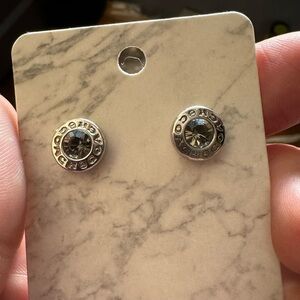 Coach stud earrings.